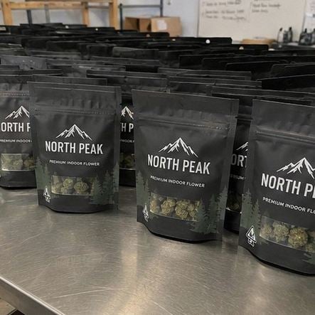 Cannabis packaging with logo — customer photo